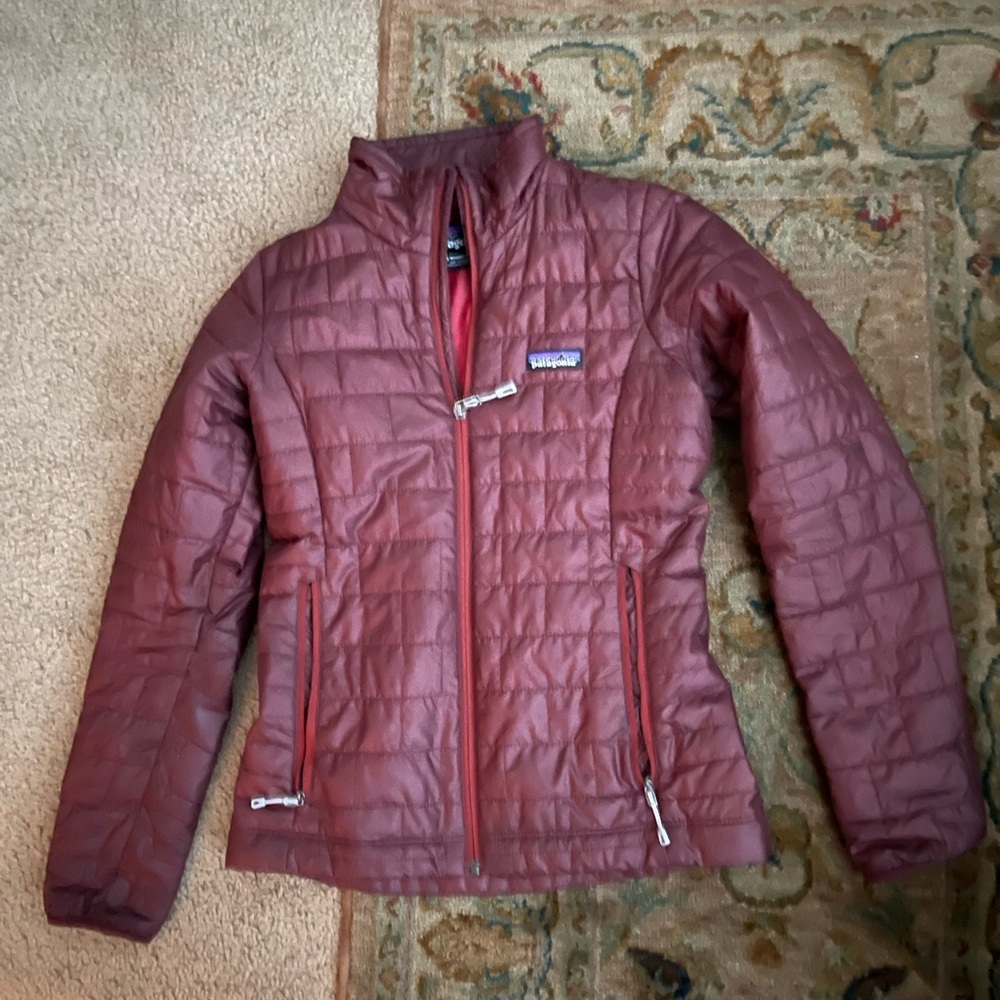 Patagonia women’s nano puff jacket. Color is burnt sienna. XXS